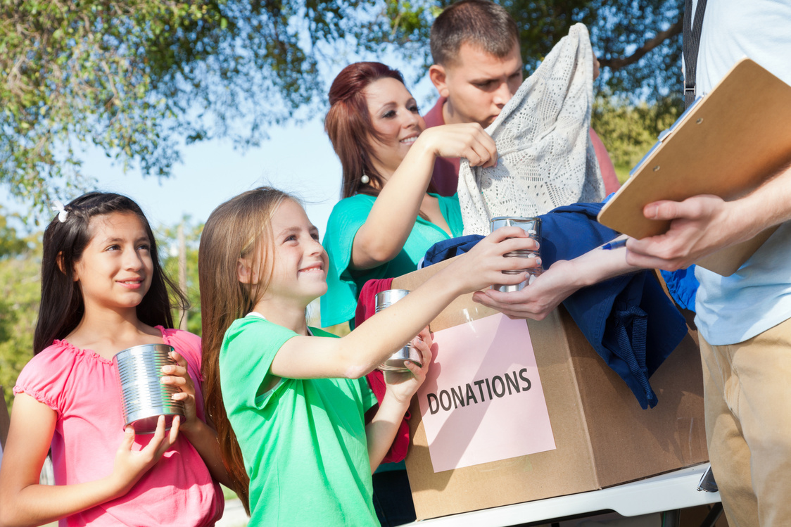 Children donate items during charity event